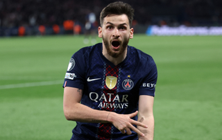 Paris Saint-Germain's Georgian forward #07 Khvicha Kvaratskhelia celebrates after scoring his team fourth goal during the UEFA Champions League semi-final first leg