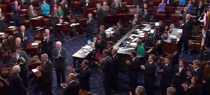 The Senate floor claps for Senator John McCain.