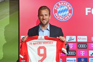 Harry Kane poses with his number nine shirt after signing for Bayern Munich, August 2023