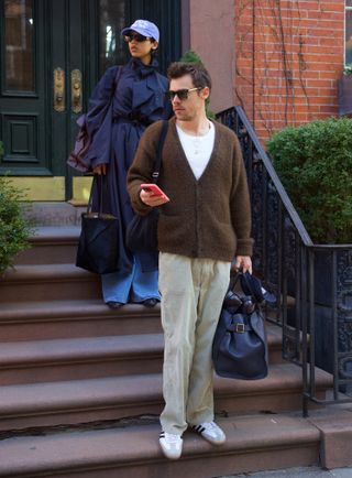 Harry Styles and Taylor Russell step out for a day date carrying four bags from The Row and Loewe between them.