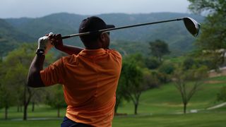 People playing golf wearing an Apple Watch