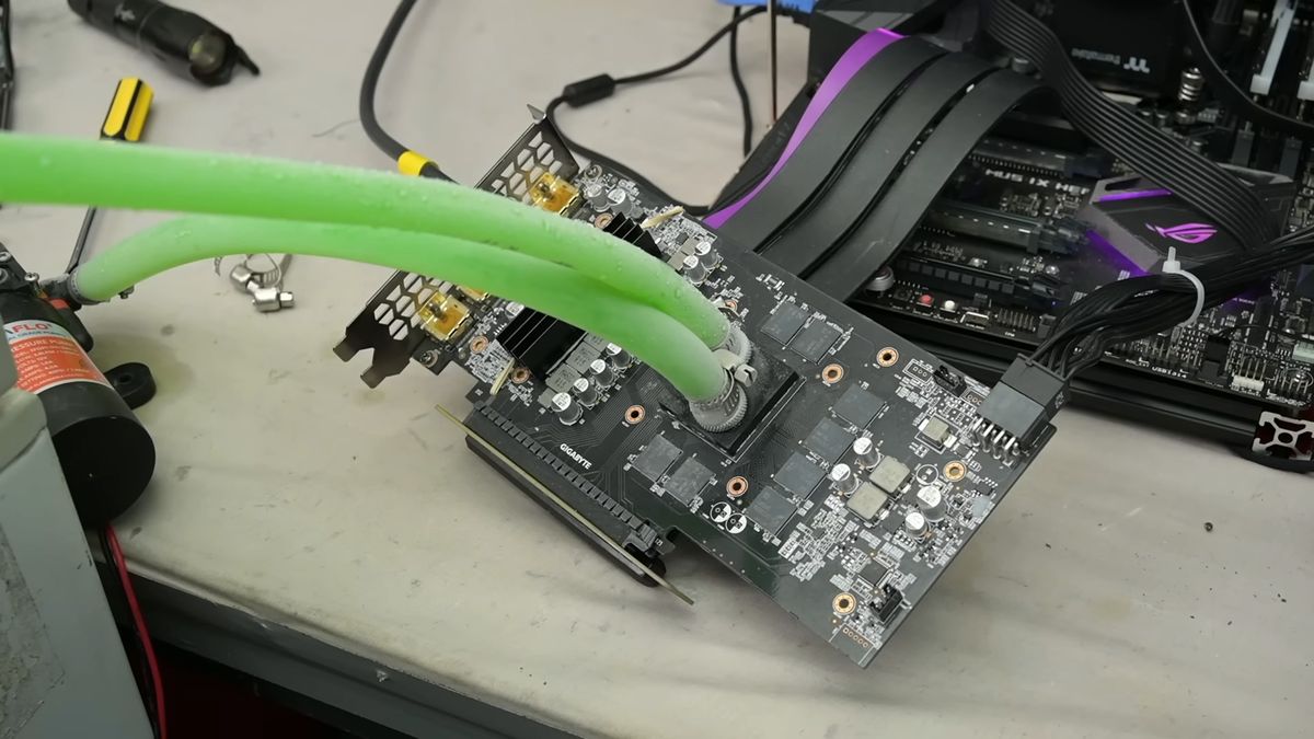 Modder pumps liquid directly over bare GPU silicon via 3D-printed block — drops RTX 2060 Super load temps to 28°C despite initial leaks