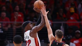 Jimmy Butler #22 of the Miami Heat attempts a shot against Bogdan Bogdanovic #13 of the Atlanta Hawks during the second half in Game Four of the Eastern Conference First Round at State Farm Arena on April 24, 2022 in Atlanta, Georgia.