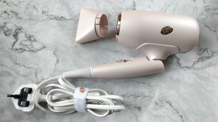 T3 Afar hair dryer folded, with card bundled and nozzle detached