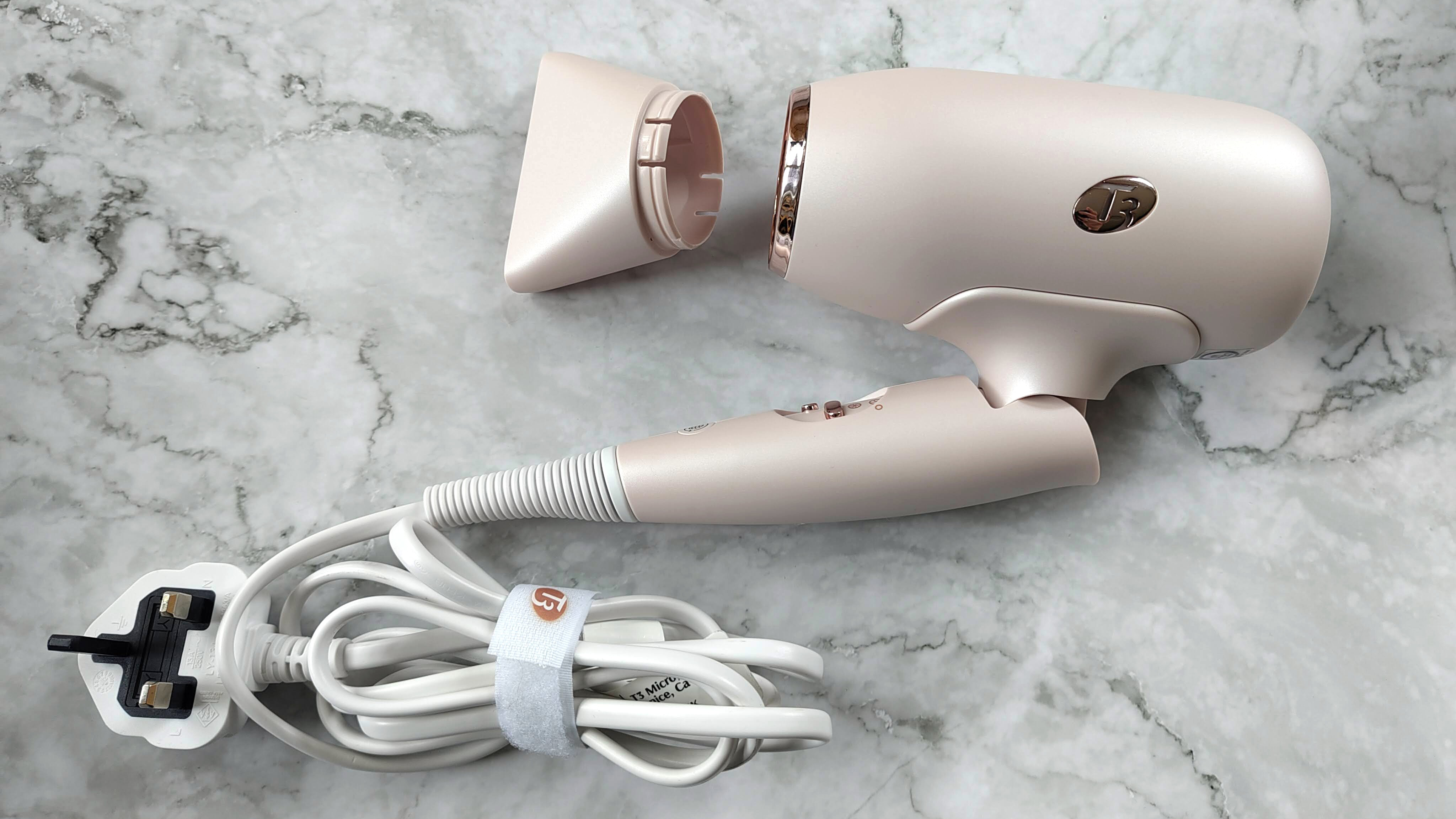 T3 Afar hair dryer folded, with card bundled and nozzle detached