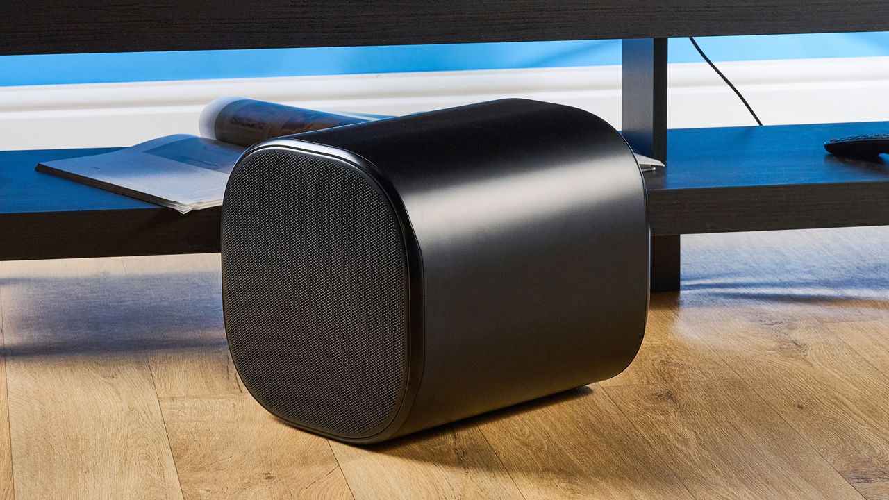 the jbl bar 1300xmk2 in black photographed against the blue tom's guide background