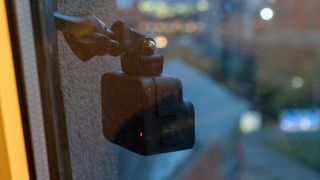 Insta360 Ace Pro hanging out of hotel window in Leeds