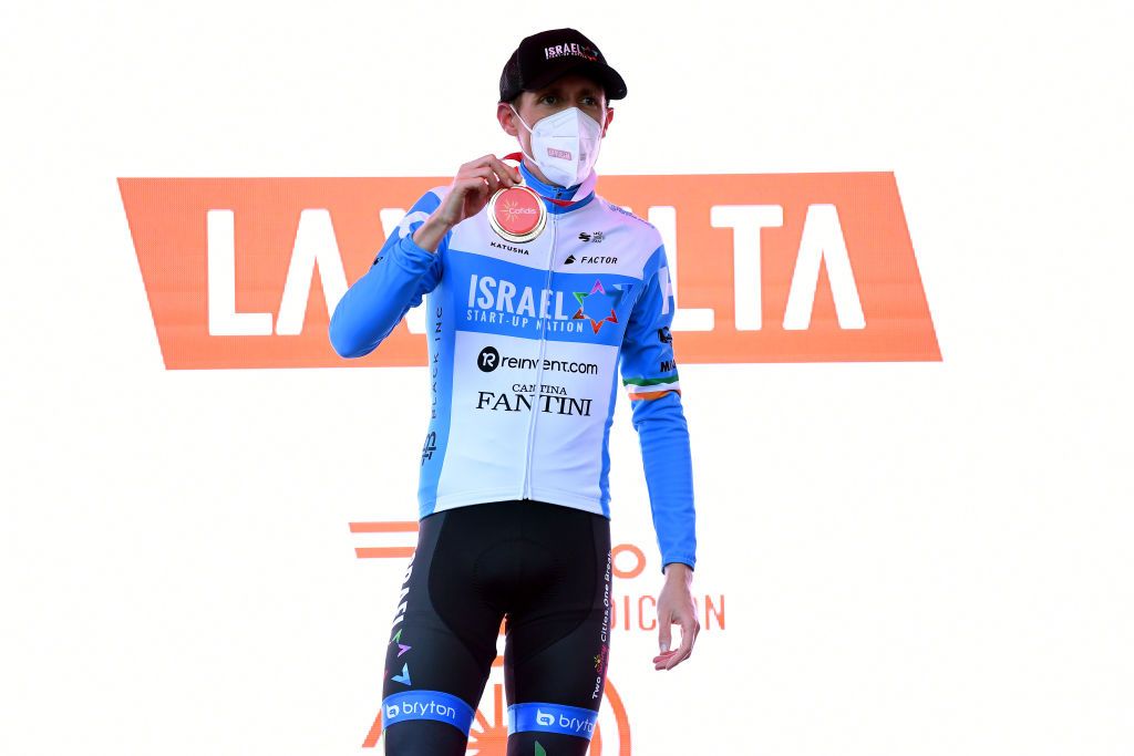 VINUESA SPAIN OCTOBER 22 Podium Daniel Martin of Ireland and Team Israel StartUp Nation Celebration Mask Covid safety measures Trophy during the 75th Tour of Spain 2020 Stage 3 a 1661km stage from Lodosa to La Laguna Negra Vinuesa 1735m lavuelta LaVuelta20 La Vuelta on October 22 2020 in Vinuesa Spain Photo by David RamosGetty Images