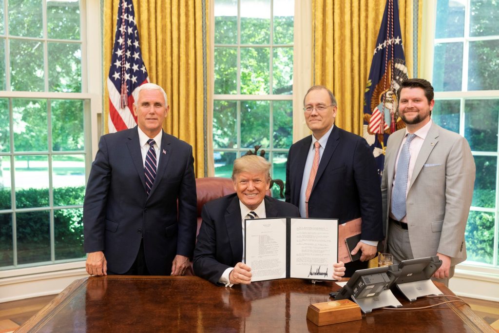 President Donald Trump holds the signed copy of Space Policy Directive 2 in the Oval Office May 24, 2018 with Vice President Mike Pence, National Space Council Executive Secretary Scott Pace and Deputy Executive Secretary and Chief of Staff of the Nationa