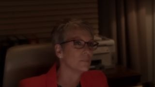 Jamie Lee Curtis wearing glasses and a red top in NCIS