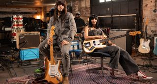 Mark Speer of Khruangbin sits with his natural finish Fender Strat while Laura Lee holds her new signature Jazz Bass.