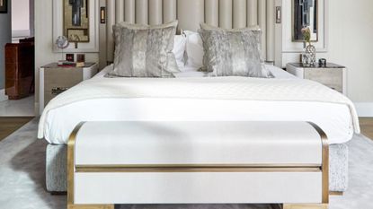 Bed in luxury neutral bedroom on box spring bed base