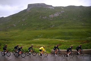 TIGNES FRANCE JULY 04 Tadej Pogaar of Slovenia and UAETeam Emirates yellow leader jersey The peloton during the 108th Tour de France 2021 Stage 9 a 1449km stage from Cluses to Tignes Monte de Tignes 2107m Landscape Fog LeTour TDF2021 on July 04 2021 in Tignes France Photo by Chris GraythenGetty Images