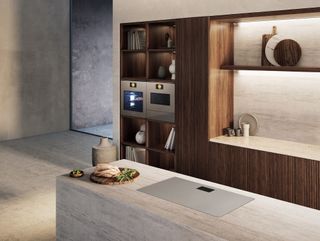 a wood and stone kitchen with modern appliances