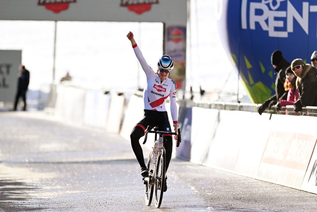 VERMIGLIO ITALY DECEMBER 17 Puck Pieterse of The Netherlands and Team Alpecin Deceuninck celebrates at finish line as race winner during the 2nd UCI Cyclocross World Cup Val Di Sole 2022 Womens Elite CXWorldCup on December 17 2022 in Vermiglio Italy Photo by Dario BelingheriGetty Images
