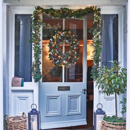 Garland hung around grey door