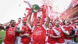 Martin Odegaard of Arsenal lifts the Premier League trophy during the Premier League match between Crystal Palace and Arsenal at Selhurst Park on May 24, 2026 in London, England