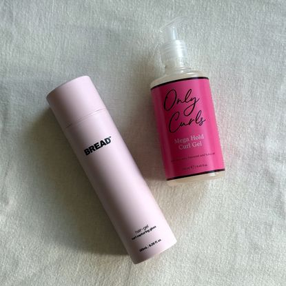 The Bread Beauty and Only Curls gels laid on an off-white fabric background