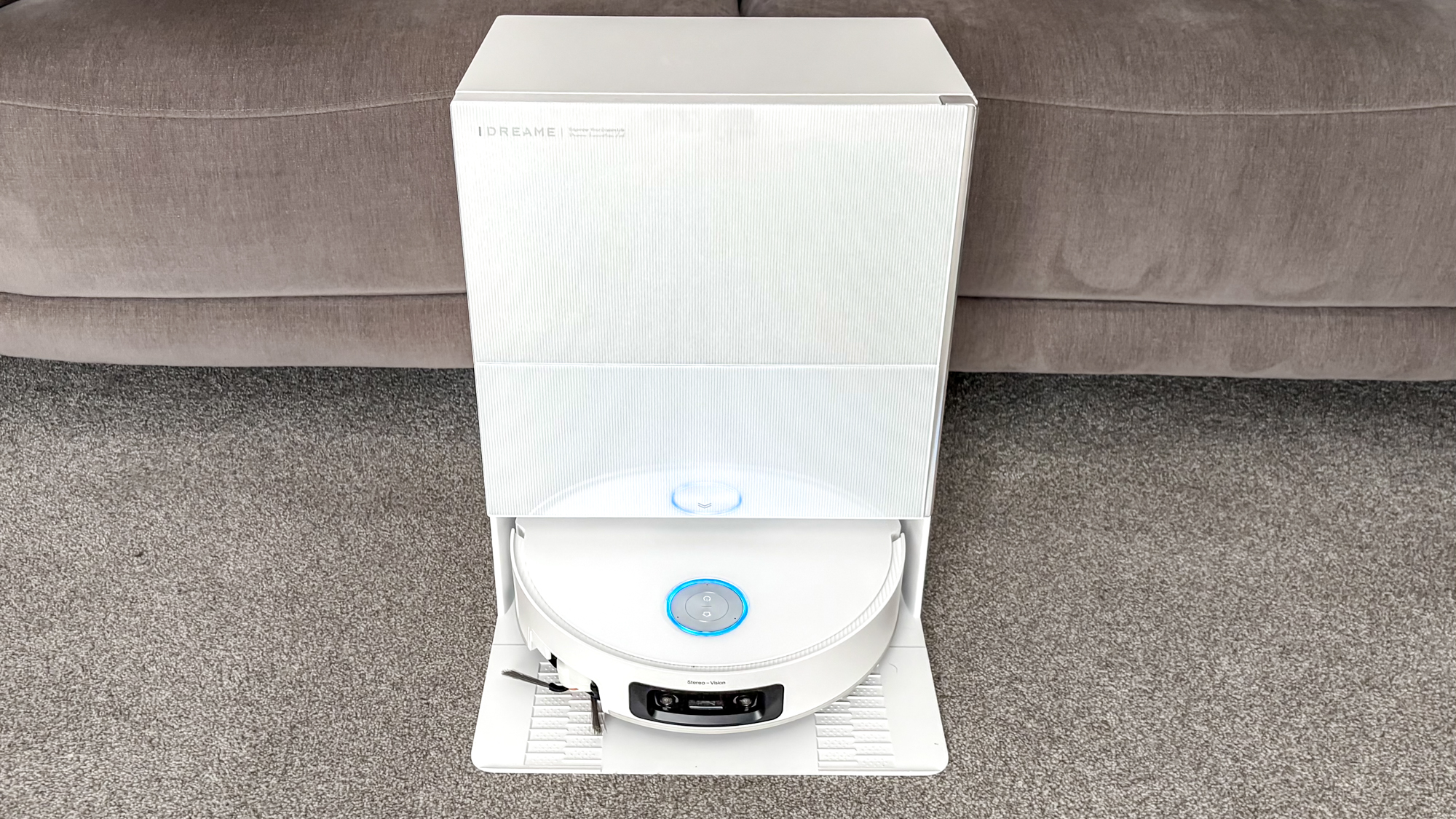 Dreame X60 Max Ultra Complete in white photographed on gray carpet.