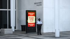 A security officer guards the entrance area at the John F. Kennedy Center for the Performing Arts in Washington, D.C.