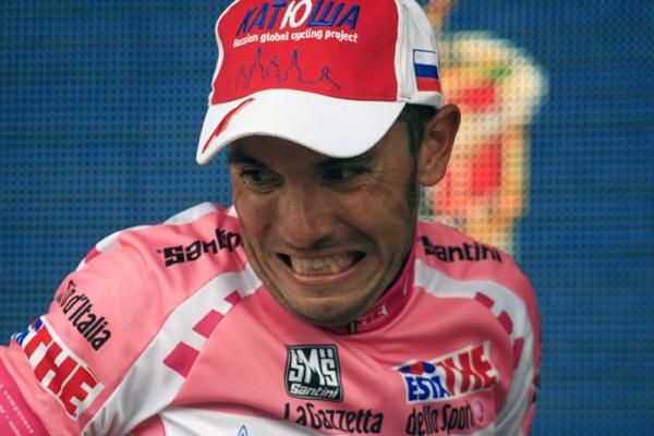 Giro d'Italia leader Joaquim Rodriguez uncorks the champagne bottle with verve and gusto.