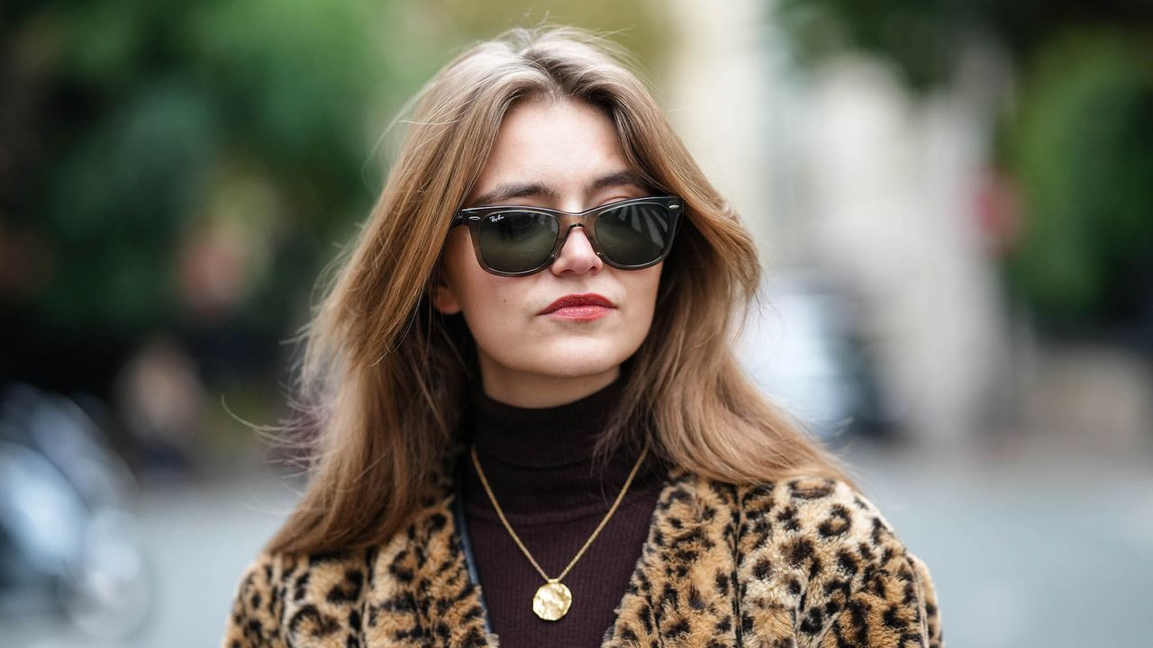 Segolene Hyppolite wears leopard coat and sunglasses with bouncy hair from the best round brushes for blowdrying