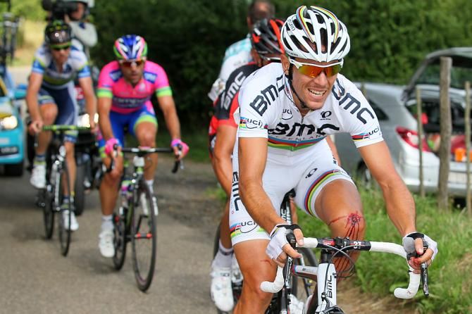 Philippe Gilbert chases with a bloody knee