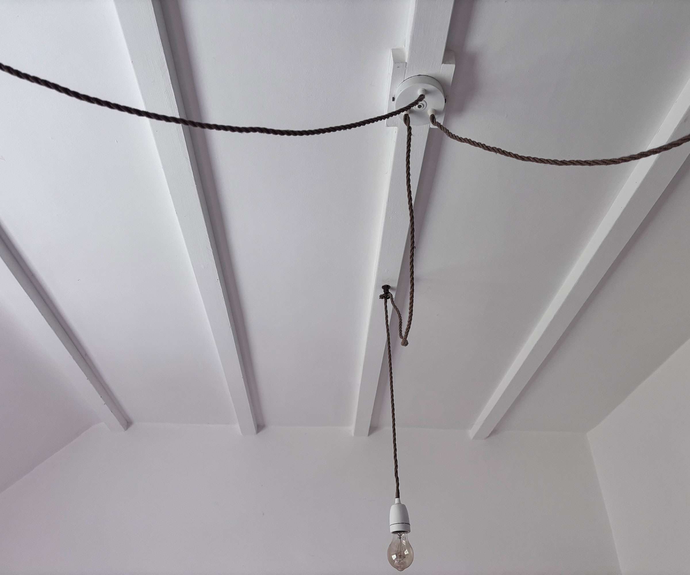 whitewashed ceiling beams in bedroom