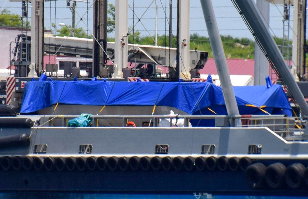 A blue tarp on the deck of the ship GO Ms. Tree covers the first payload fairing SpaceX has ever managed to pluck out of the sky. 