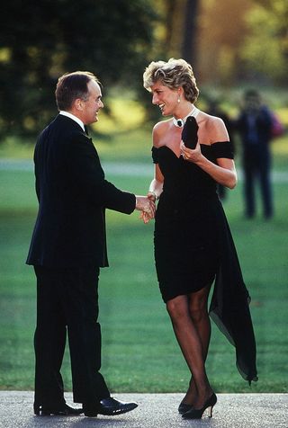 LONDON UNITED KINGDOM JUNE 29 Princess Diana Wearing A Short Black Dress Designed By Christina Stambolian For A Gala At The Serpentine Gallery In London She Is Being Greeted By Lord Palumbo Photo by Tim Graham Photo Library via Getty Images