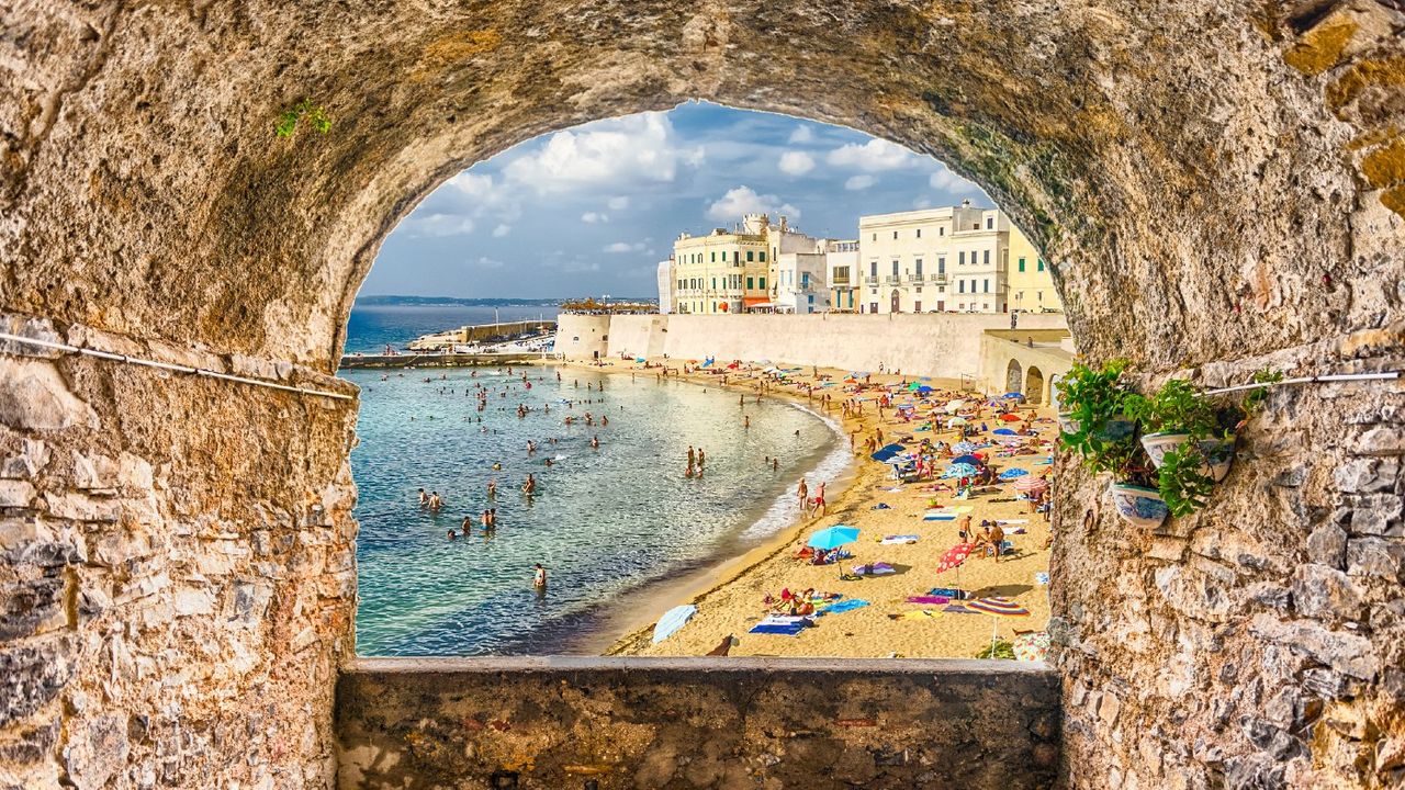 Sight of beautiful beach through rock arch