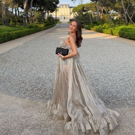 Influencer Emma Leger at a hotel in the South of France wearing a golden dress