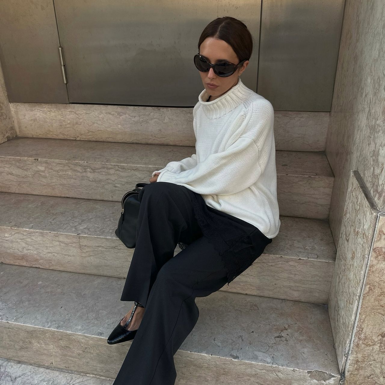 Debora Rosa in a white J.Crew rollneck sweater