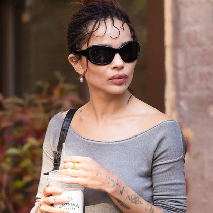 Zo&euml; Kravitz wore the red socks trend with a neutral scarf, leaving her purple version at home