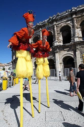 Performers keep the crowds entertained in at the start in Nimes.