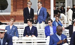 Models in suits Leisurely sitting on white field-side benches or drinking on the upper terrace
