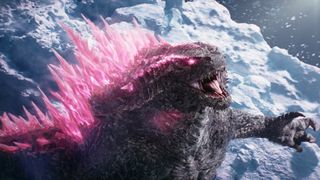 Godzilla rearing up, with his scales glowing pink as seen in Godzilla x Kong: The New Empire