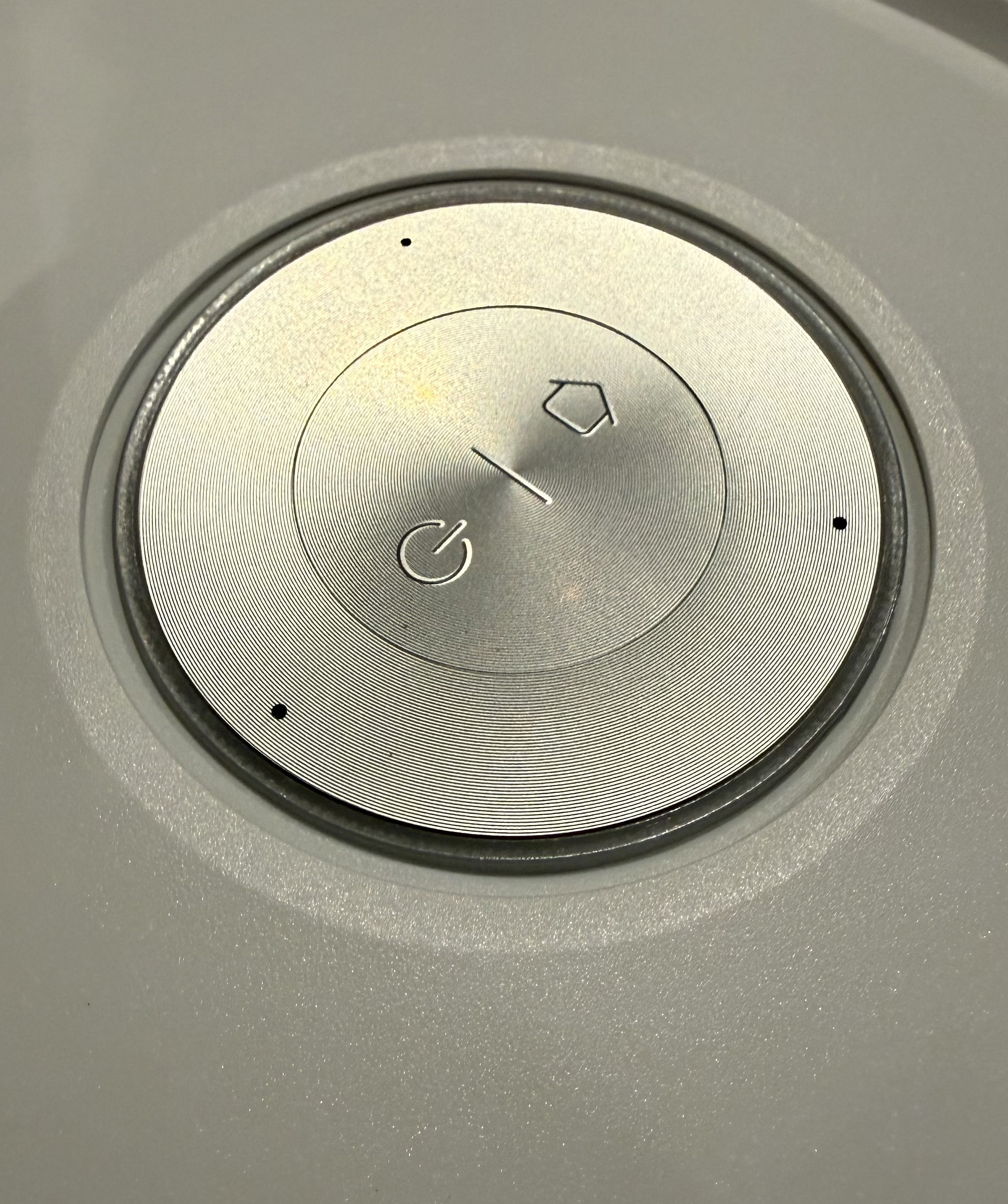 Close-up of the Dreame Aqua10 Ultra Roller&amp;rsquo;s circular top control panel with power and home buttons