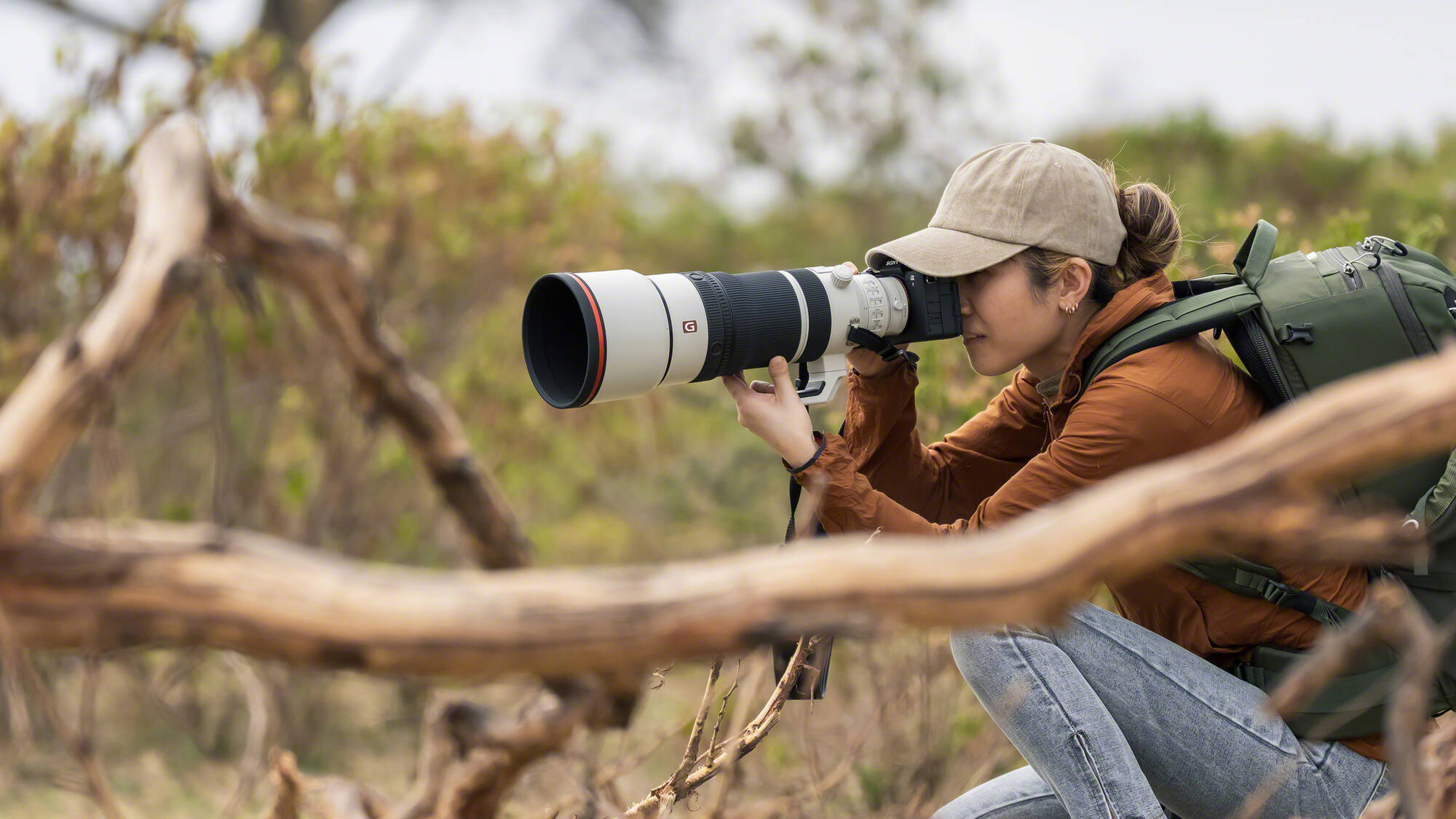 Sony FE 100-400mm f/4.5 GM OSS being used by a photographer outdoors