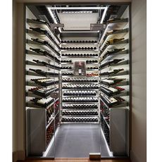 wine cellar with glass door and wine bottles