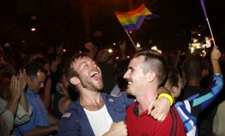 Revelers celebrate late Friday night after New York&amp;#039;s state Senate passed a bill legalizing gay marriage. The Empire State is the sixth, and largest, U.S. state to legalize same-sex marriage.