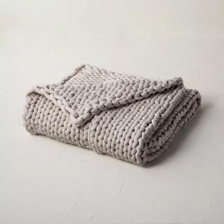 Casaluna Knit Weighted Blanket against a gray background.