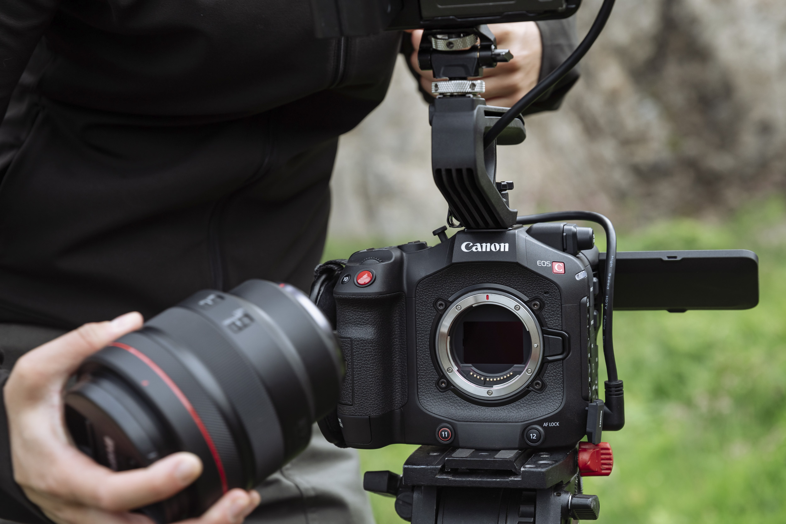 RF-mount lens being attached to the Canon EOS C80 cinema camera