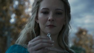 A close up of Galadriel (Morfydd Clark) looking at her ring in "The Lord of the Rings: The Rings of Power" season 2