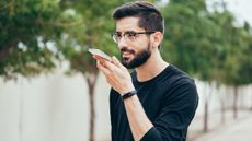 A person using dictation with a smartphone.