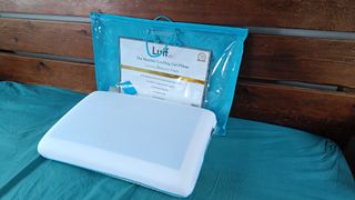 Luff Sleep The Mayfair Cooling Gel Pillow being tested and reviewed on a bed with a teal sheet