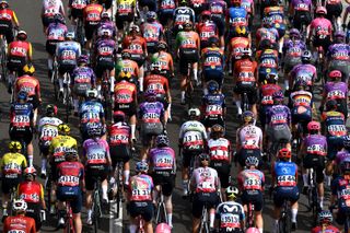 ABU DHABI BREAKWATER, UNITED ARAB EMIRATES - FEBRUARY 09: A general view of the peloton competing during the 3rd UAE Tour Women, Stage 4 a 127km stage from Abu Dhabi Fatima Bint Mubarak Ladies Academy to Abu Dhabi Breakwater / #UCIWWT / on February 09, 2025 in Abu Dhabi Breakwater, United Arab Emirates. (Photo by Tim de Waele/Getty Images)