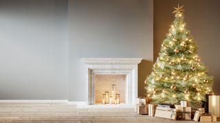 a golden artificial Christmas tree in a room with a fireplace