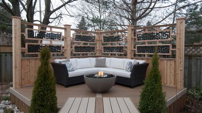 outdoor corner sofa on decking with fire pit 