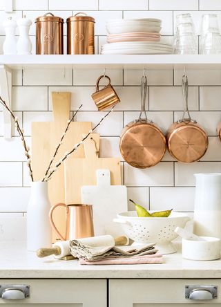 White kitchen with copper accesssories